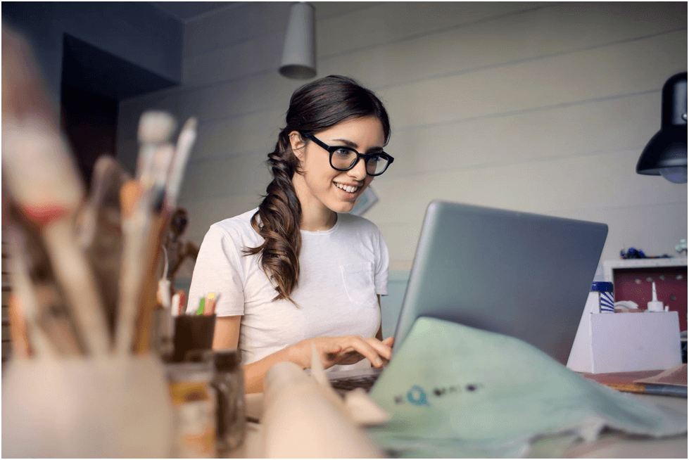 Smiling Girl using Laptop