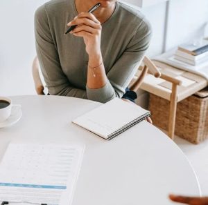 Girl Thinking and about to write in copy