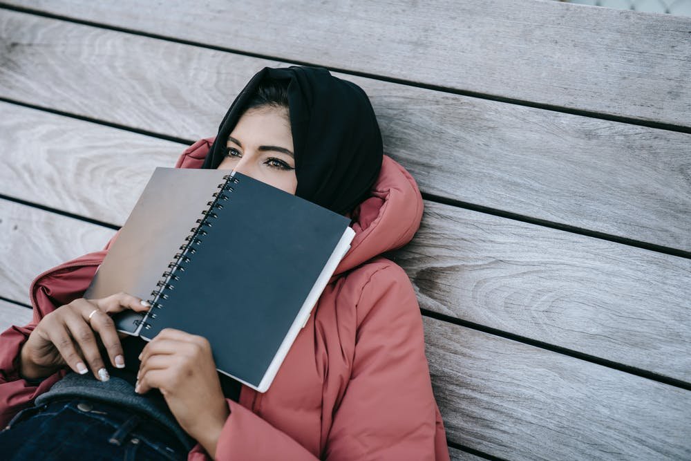 Girl thinking with copy in face