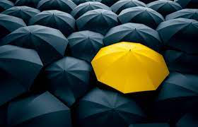 Yellow Umbrella in group of black umbrella
