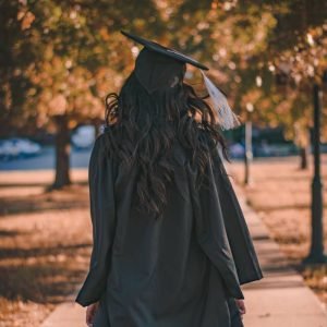 Girl Wearing Black Graduation Cap and Cloth
