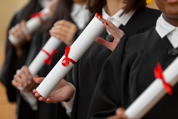 close-up-people-graduating-with-diplomas