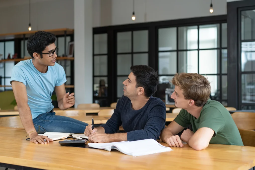 MBA students brainstorming in a classroom.