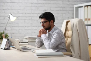 A professional-looking Indian male with an IT background