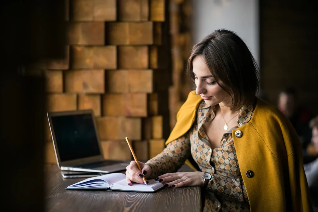 Professional writing a recommendation letter for an MBA applicant