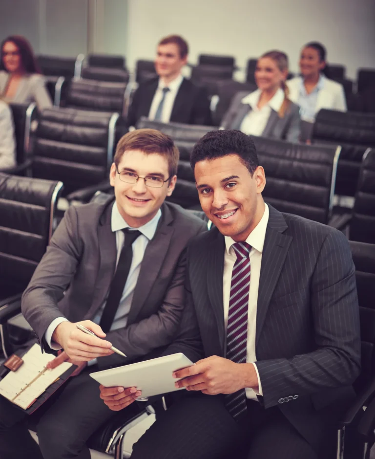 MBA student networking with finance professionals at a conference.